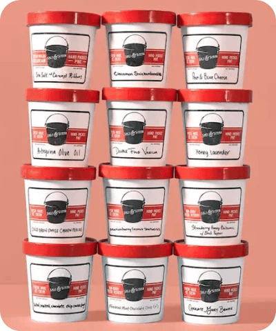 Stacked Salt & Straw branded ice cream tubs