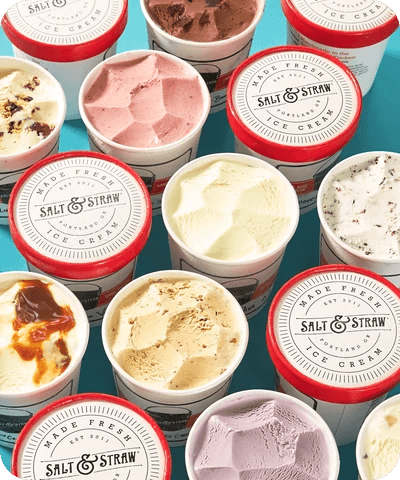 Top-down view of colorful Salt & Straw ice cream tubs